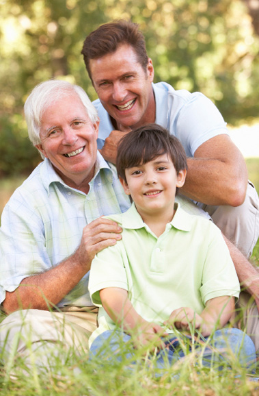 grandfather, son and grandson smiling at the camera