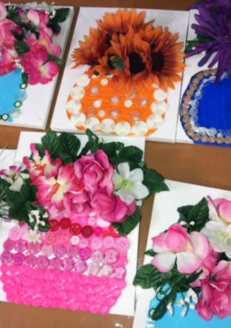 close up photo of resident button crafts flower pots with bouquet of flowers