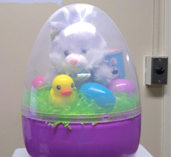 large plastic easter egg filled with stuffed animals mini easter eggs and treats as give-away prize