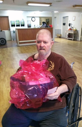Morganfield Resident Scott C pictured with going away basket