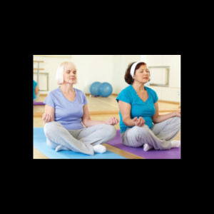two women sitting on floor, meditating, and relaxing in yoga class