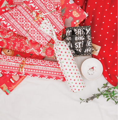 Various Red, White, Black Christmas Wrapping Paper Rolls and Squares